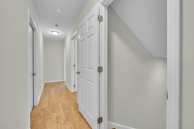 hallway featuring light hardwood / wood-style floors