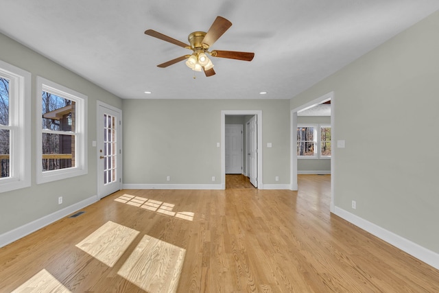 spare room featuring ceiling fan and light wood-type flooring