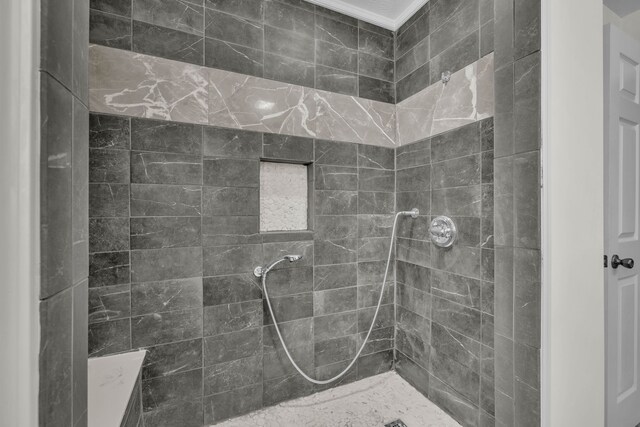 bathroom with tiled shower