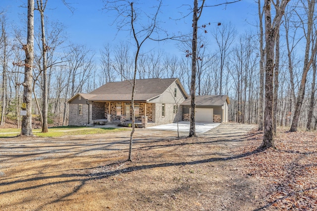 view of front of home with a porch and a garage