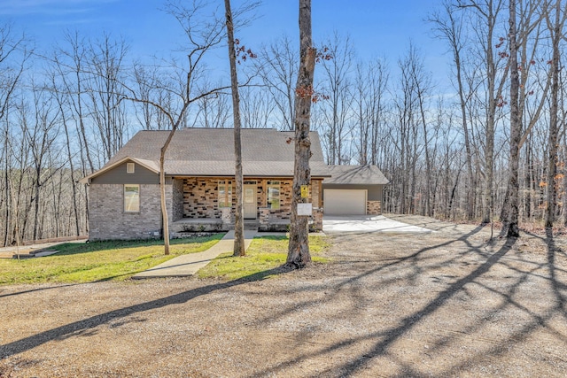 view of front of property with a front lawn and a garage