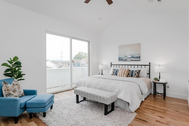 bedroom featuring ceiling fan, access to outside, light wood-type flooring, and high vaulted ceiling