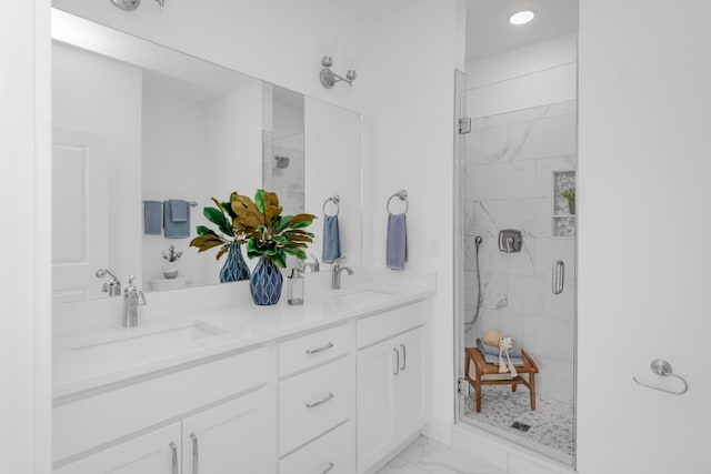 bathroom with tile flooring, dual sinks, a shower with door, and oversized vanity