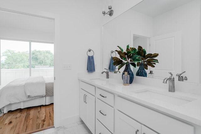 bathroom with tile flooring and double vanity