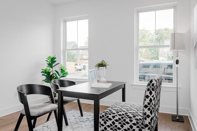 office area with light hardwood / wood-style floors