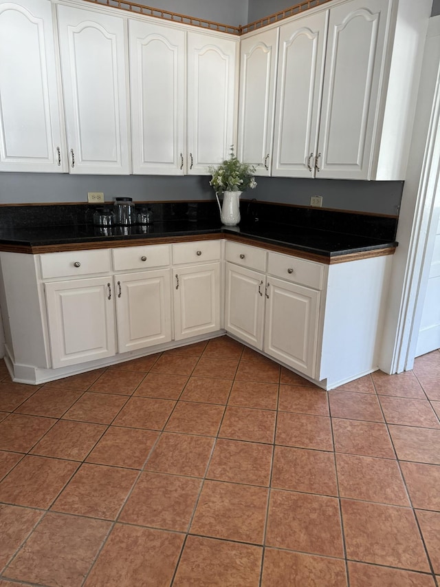 kitchen featuring white cabinets and tile patterned floors