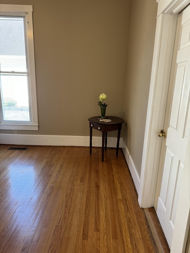 unfurnished room featuring hardwood / wood-style flooring