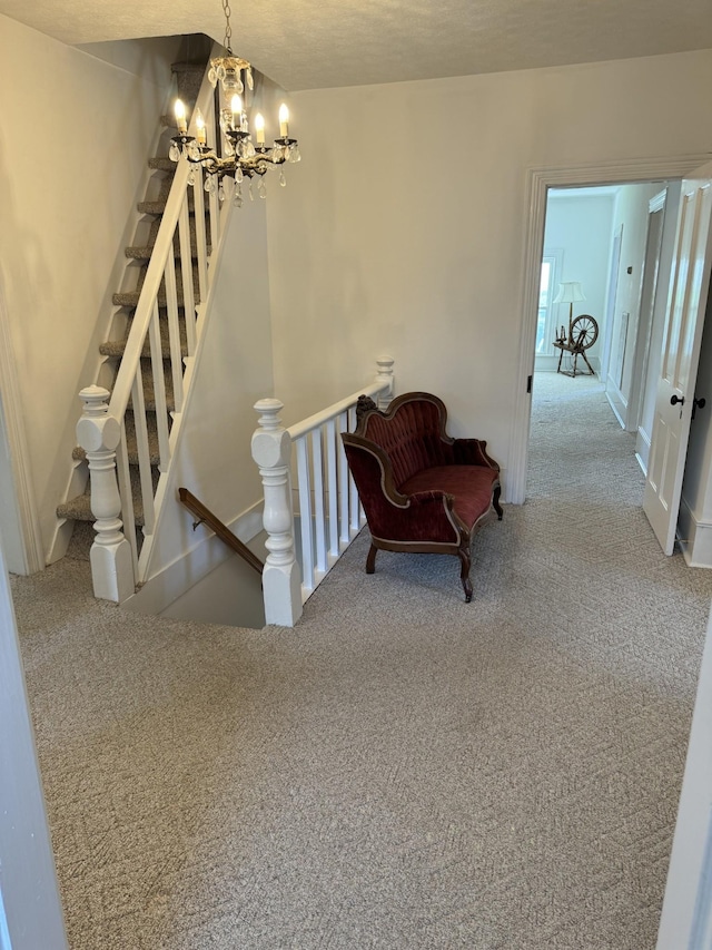 interior space with carpet flooring and an inviting chandelier