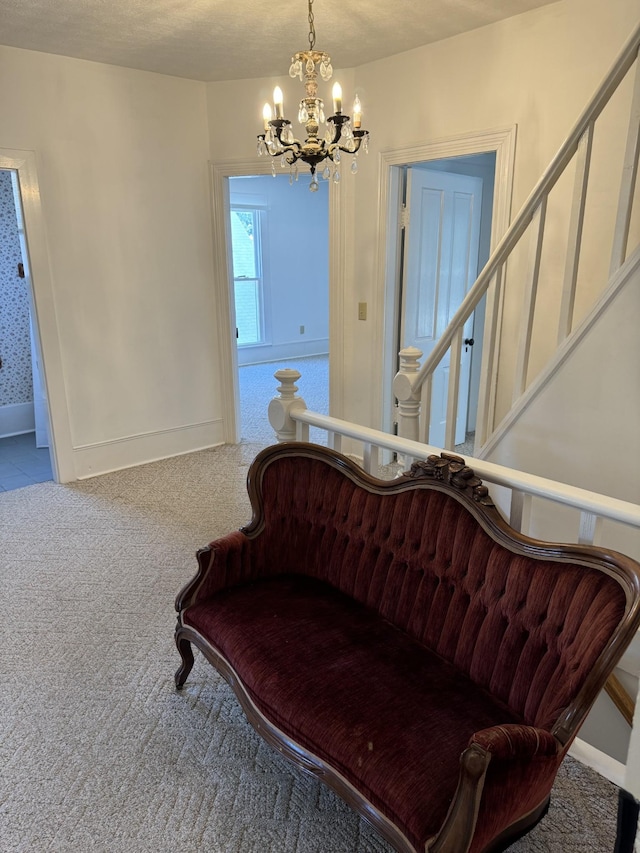 interior space featuring carpet floors and an inviting chandelier