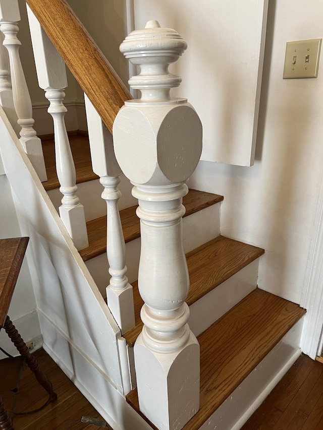 staircase featuring hardwood / wood-style floors