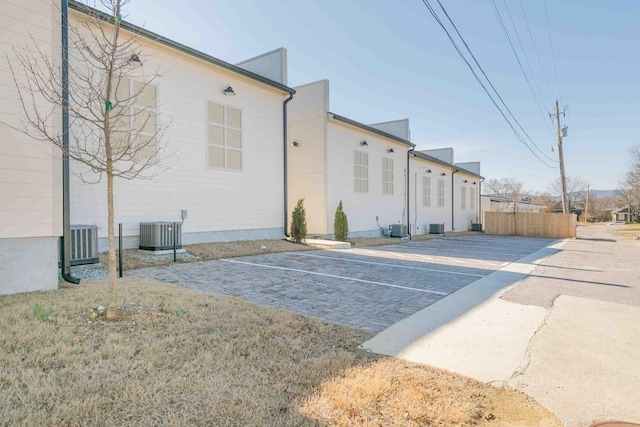 rear view of property featuring cooling unit