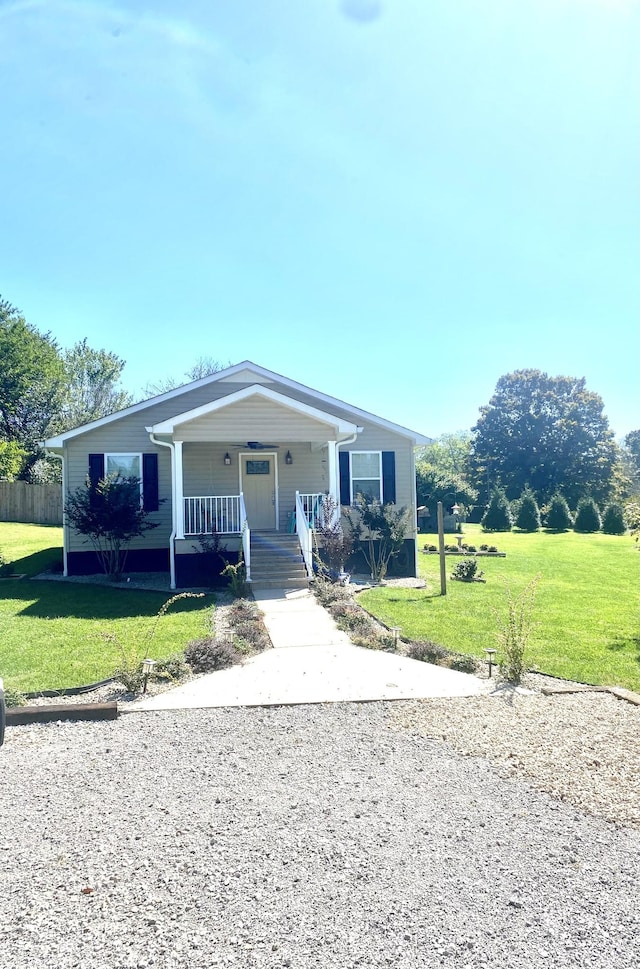 bungalow-style house with a porch and a front yard