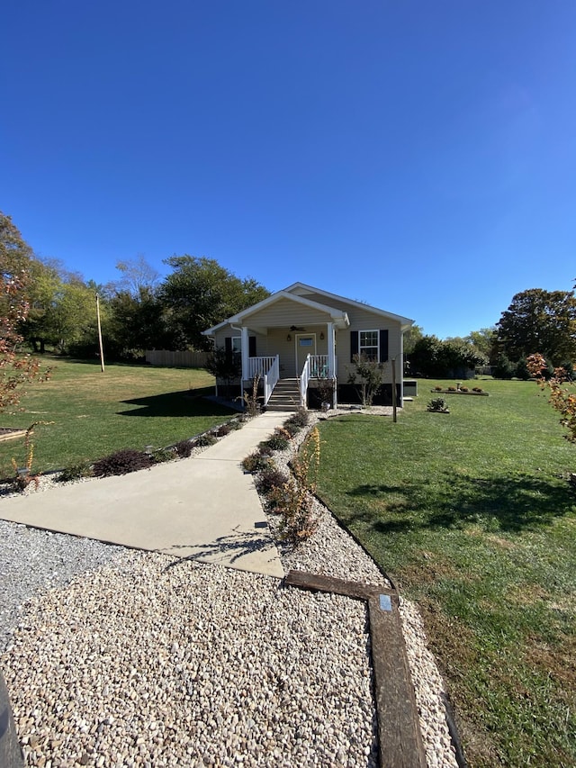 bungalow-style house featuring a front yard and covered porch