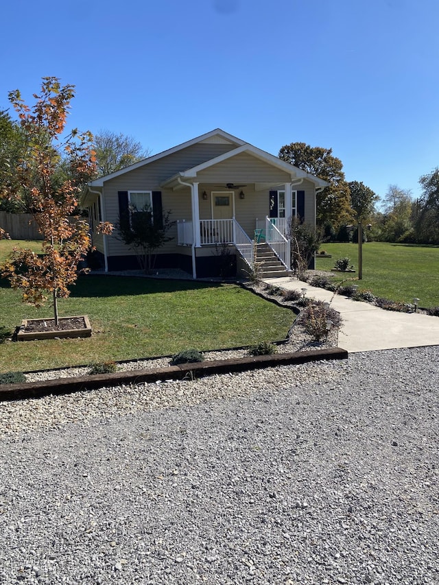 bungalow featuring a porch and a front yard
