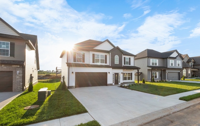 view of front of home featuring a garage and a front yard