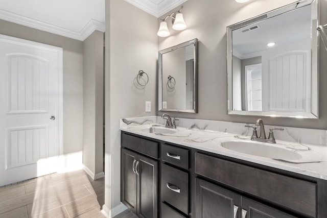 bathroom featuring vanity and ornamental molding