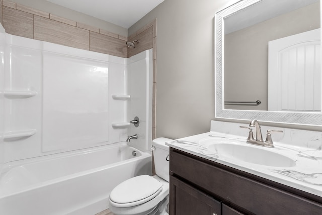 full bathroom with bathtub / shower combination, vanity, and toilet