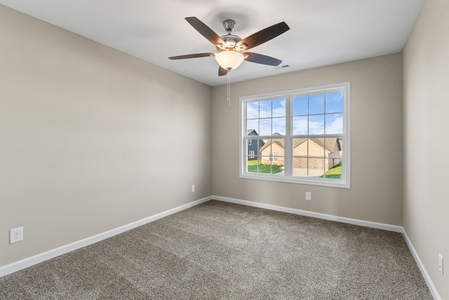 spare room with carpet flooring and ceiling fan