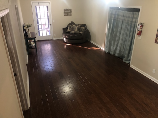 interior space with dark hardwood / wood-style flooring