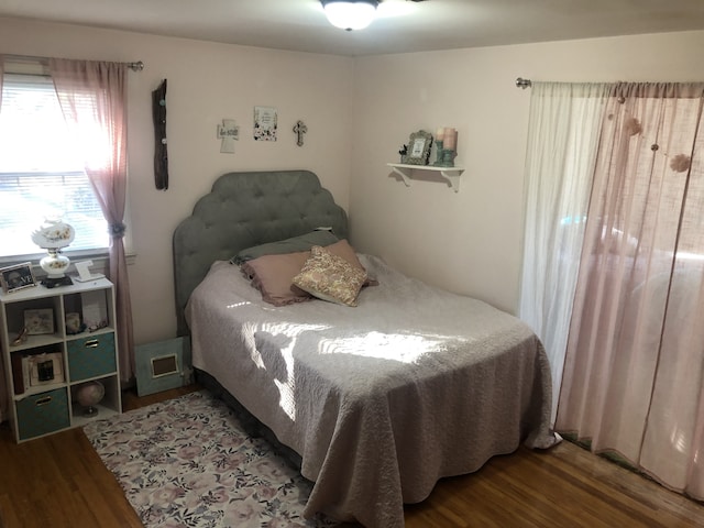 bedroom featuring wood-type flooring