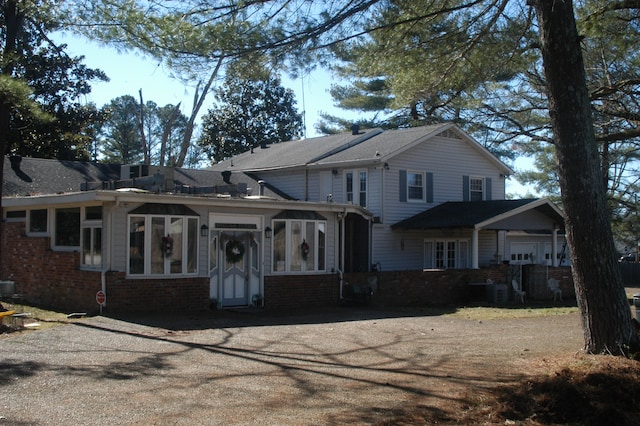 view of front of home with a sunroom