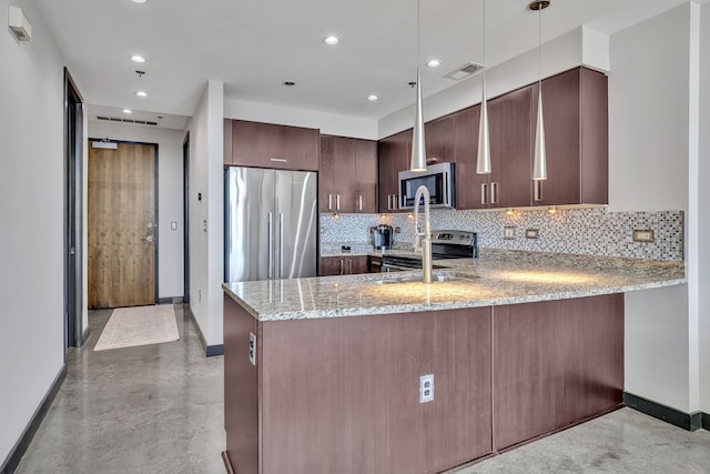 kitchen with appliances with stainless steel finishes, light stone counters, tasteful backsplash, and kitchen peninsula