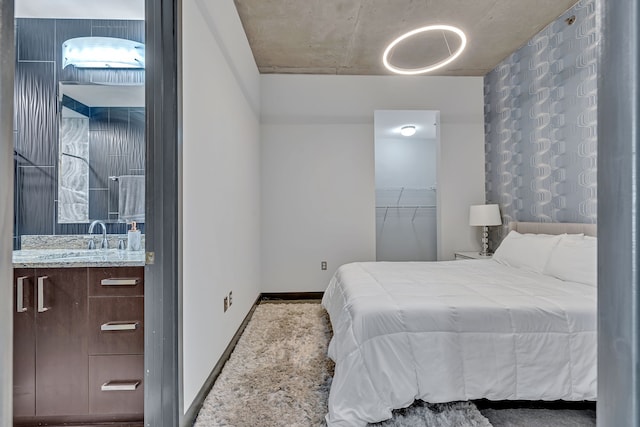 bedroom featuring carpet and sink