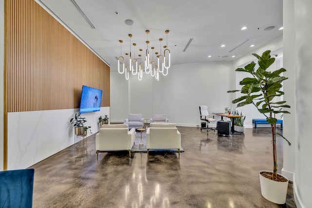 dining area with a notable chandelier, wooden walls, and concrete floors