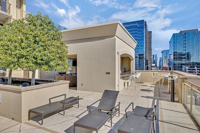 view of patio / terrace with a balcony