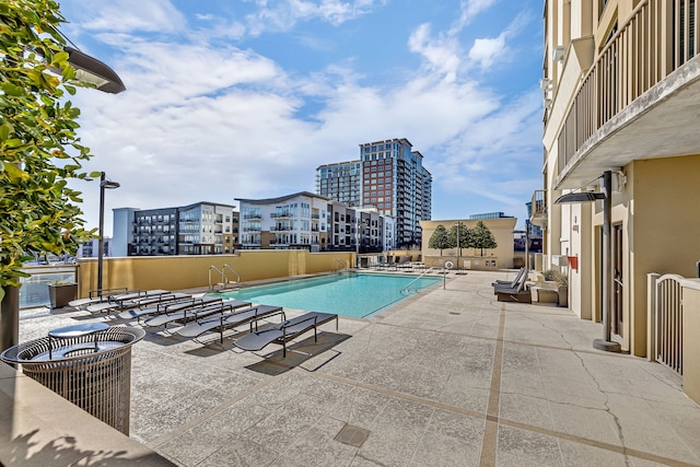 view of swimming pool with a patio area