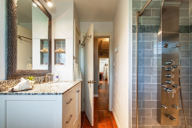 bathroom featuring vanity and hardwood / wood-style flooring