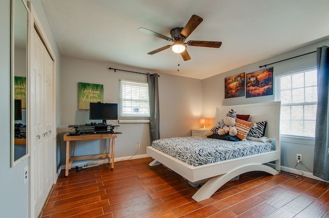 bedroom with ceiling fan and hardwood / wood-style flooring