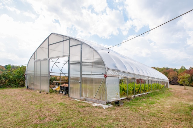 view of outdoor structure with a lawn