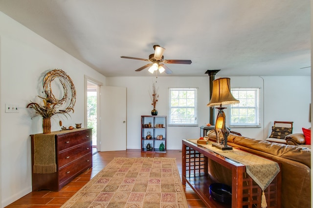 living room with ceiling fan and hardwood / wood-style flooring