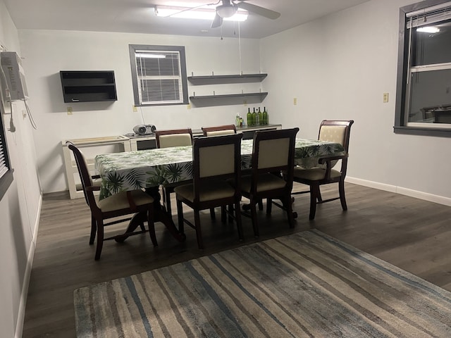 dining area featuring ceiling fan and dark wood-type flooring