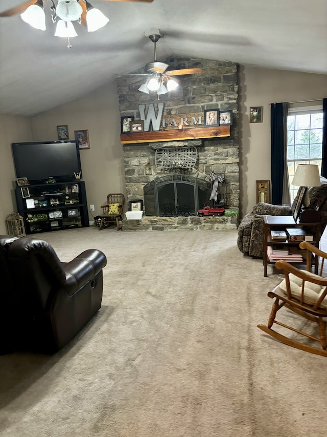 carpeted living room with vaulted ceiling, ceiling fan, and a fireplace