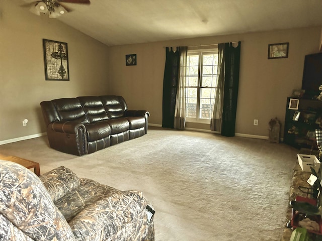 carpeted living room featuring ceiling fan and vaulted ceiling