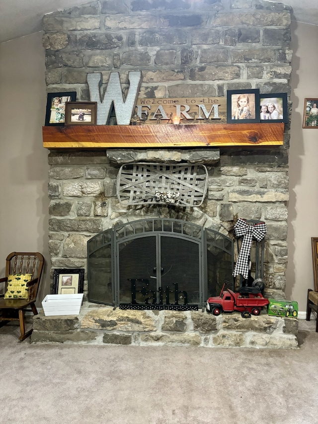 bar featuring carpet and a fireplace