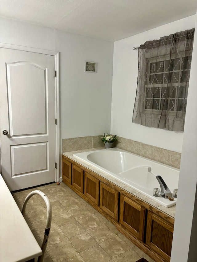 bathroom featuring tile floors and a washtub