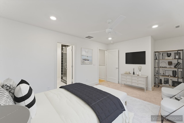 carpeted bedroom with connected bathroom and ceiling fan