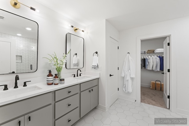 bathroom featuring double sink vanity and tile flooring