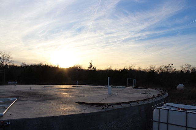 view of pool at dusk