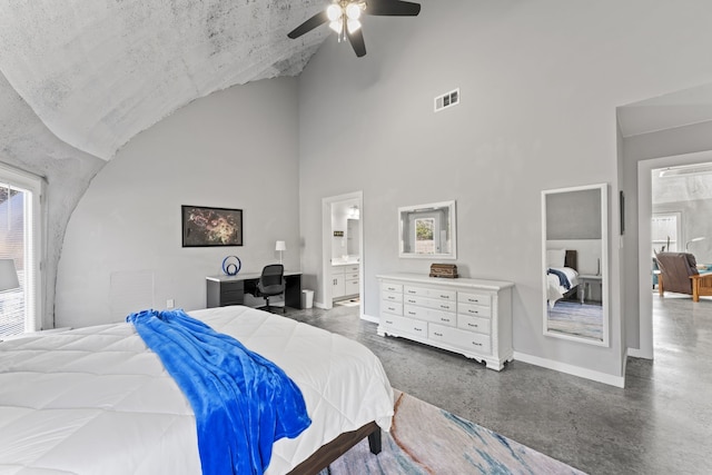 bedroom with a textured ceiling, high vaulted ceiling, ceiling fan, and ensuite bathroom