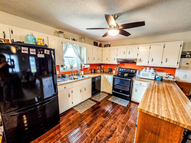 kitchen featuring a textured ceiling, dark hardwood / wood-style flooring, black appliances, sink, and white cabinets