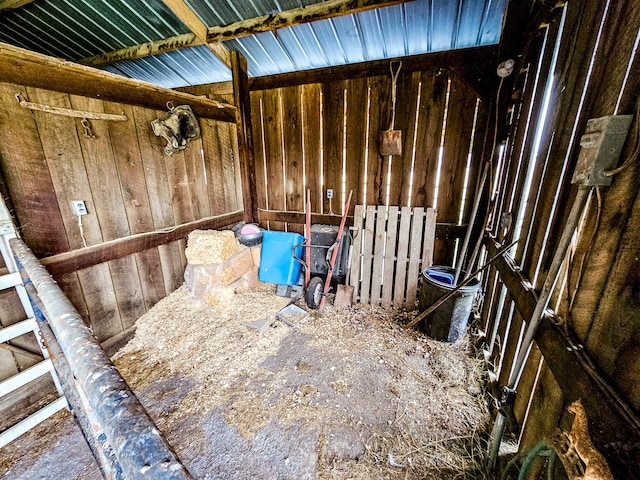 miscellaneous room featuring wood walls