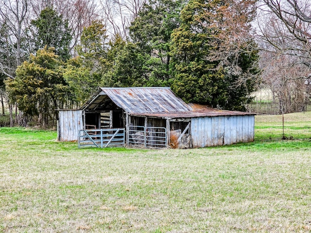 view of outbuilding featuring a lawn