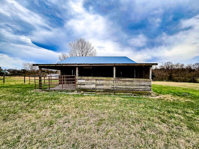 view of outbuilding with a rural view