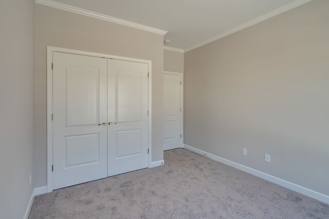 7112 Maddenwood Ln, Hermitage, TN 37076 - unfurnished bedroom featuring crown molding, carpet flooring, baseboards, and a closet