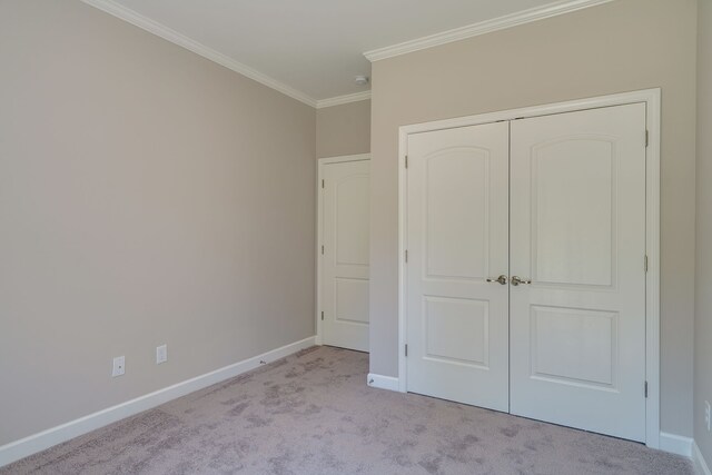 7112 Maddenwood Ln, Hermitage, TN 37076 - unfurnished bedroom with carpet floors, ornamental molding, baseboards, and a closet