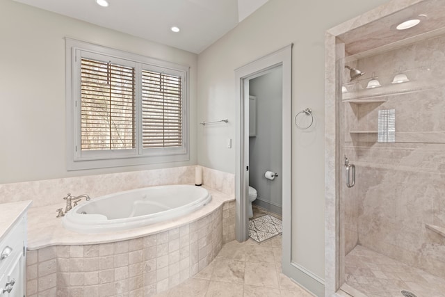 full bathroom featuring vanity, toilet, independent shower and bath, and tile patterned floors